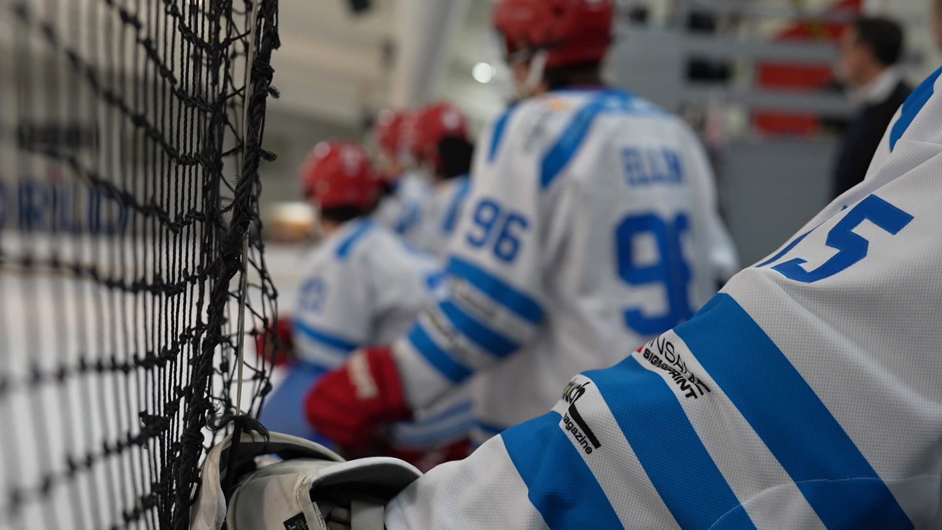 Close up shot of the back of ice hockey players 