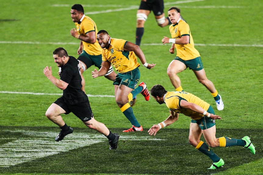 Dane Coles breaks away for the All Blacks against the Wallabies