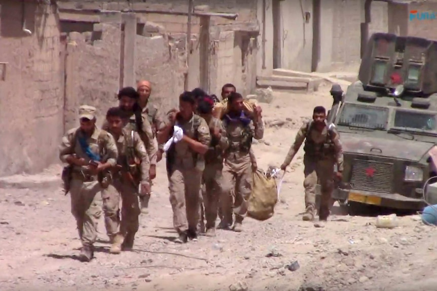 US-backed Syrian Democratic Forces (SDF) fighters in the eastern side of Raqqa, Syria.