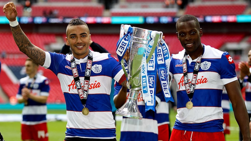 Danny Simpson (L) and Nedum Onouha (R) celebrate QPR's win over Derby in the Championship playoff.