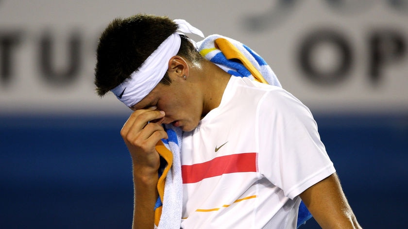 Tired Tomic: The 17-year-old toiled for nearly four hours before losing in five sets.