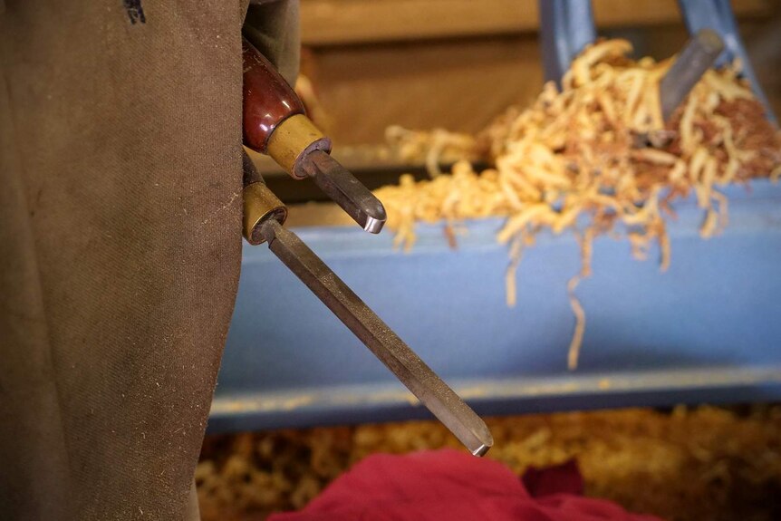 Two wood working tools are held under the arm of Dale Cordwell, one tool is shortened from wear.
