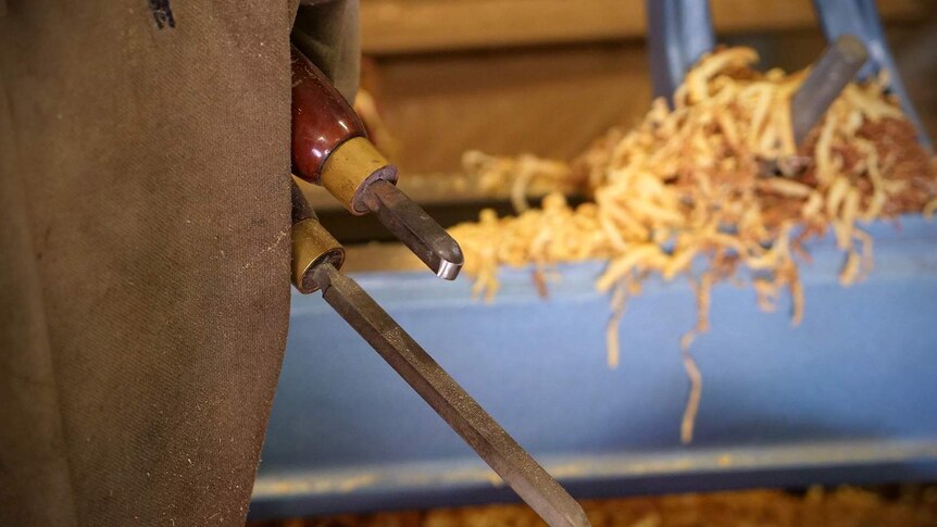 Two wood working tools are held under the arm of Dale Cordwell, one tool is shortened from wear.
