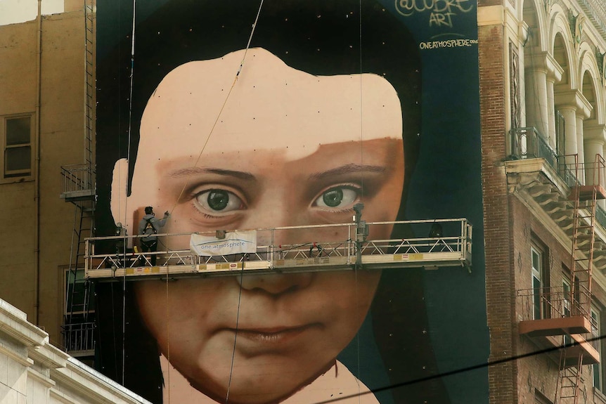 A mural of Swedish climate activist Greta Thunberg adorns a wall in San Francisco.