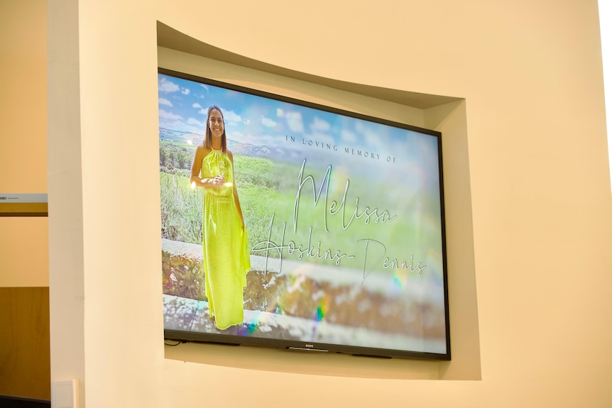 An image of a woman on a video screen.