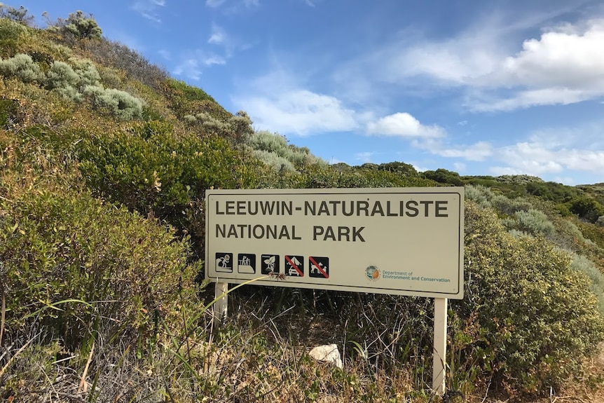A sign installed in coastal scrub reading Leeuwin Naturaliste National Park
