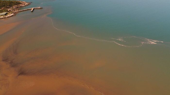 Sediment after a storm runs off into the sea near Townsville