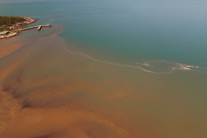 Sediment after a storm runs off into the sea near Townsville