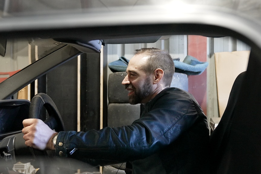 Che Baker inside his DeLorean