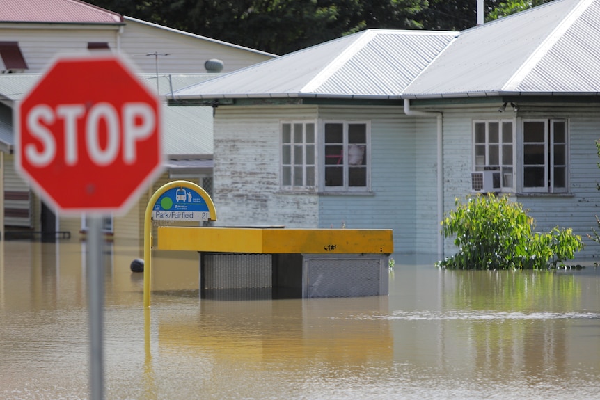 A house sits in high flood waters.