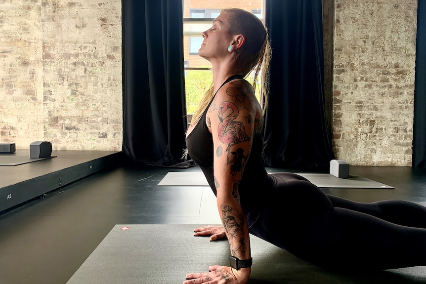 A woman doing yoga.