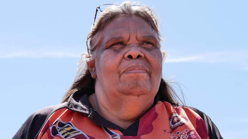 indigenous woman looking out of frame