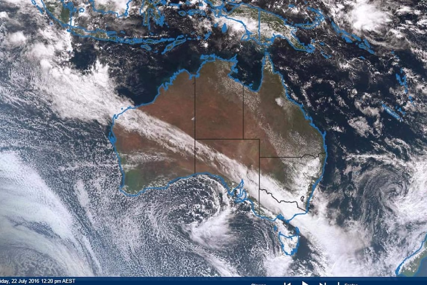 Satellite photo showing a stripe of cloud crossing Australia.