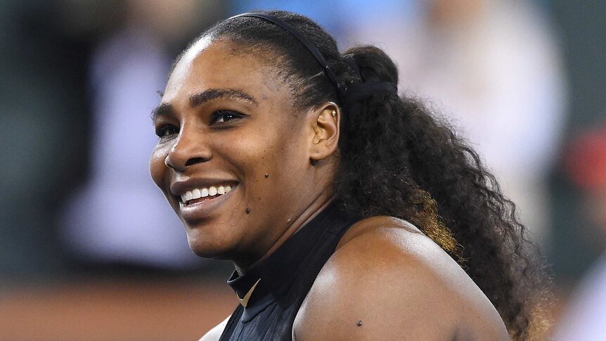 Serena Williams smiles as she looks to the crowd after winning her comeback match in Indian Wells.