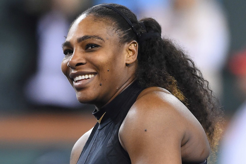 Serena Williams smiles as she looks to the crowd after winning her comeback match in Indian Wells.