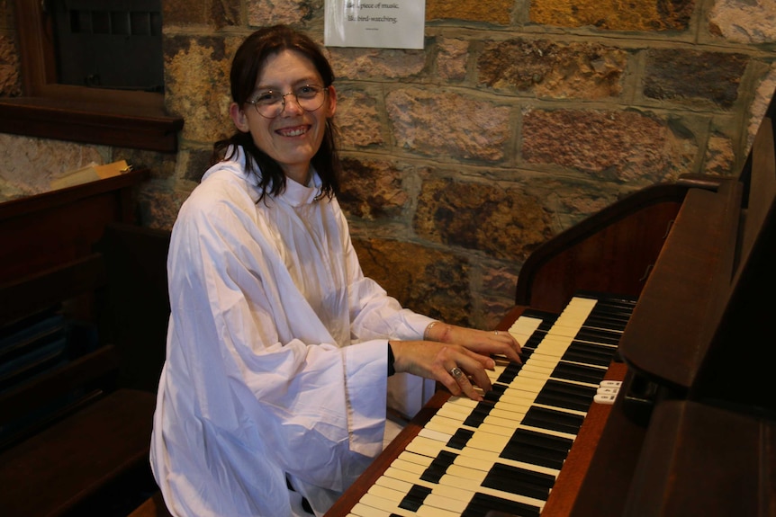 Gemma Dashwood plays the organ in a church.