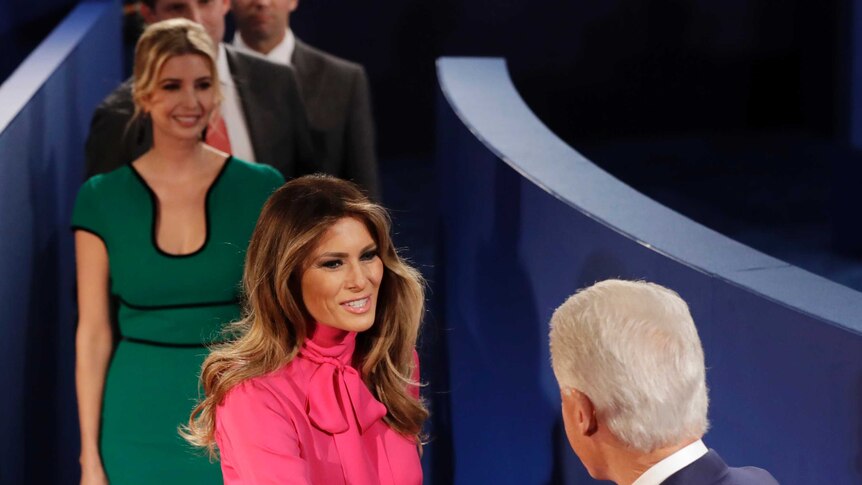 Bill Clinton shakes hands with Melania Trump, wife of Donald Trump before the second presidential debate