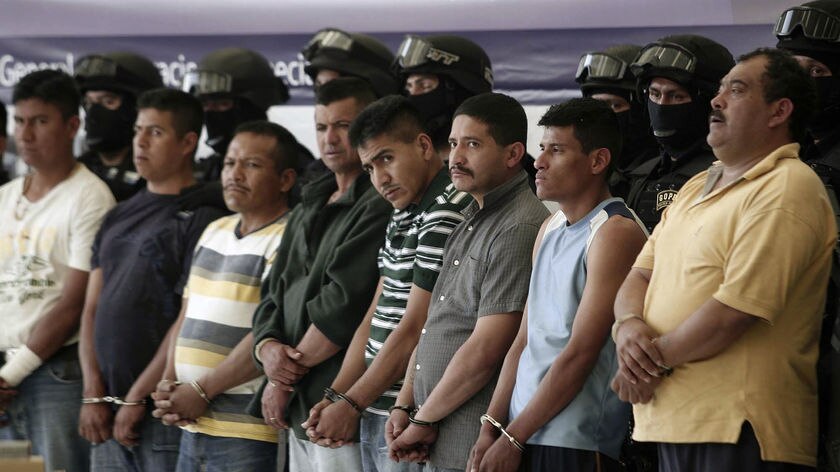 Mexican federal police present members of a crime gang accused of extortion, kidnapping and drug tra