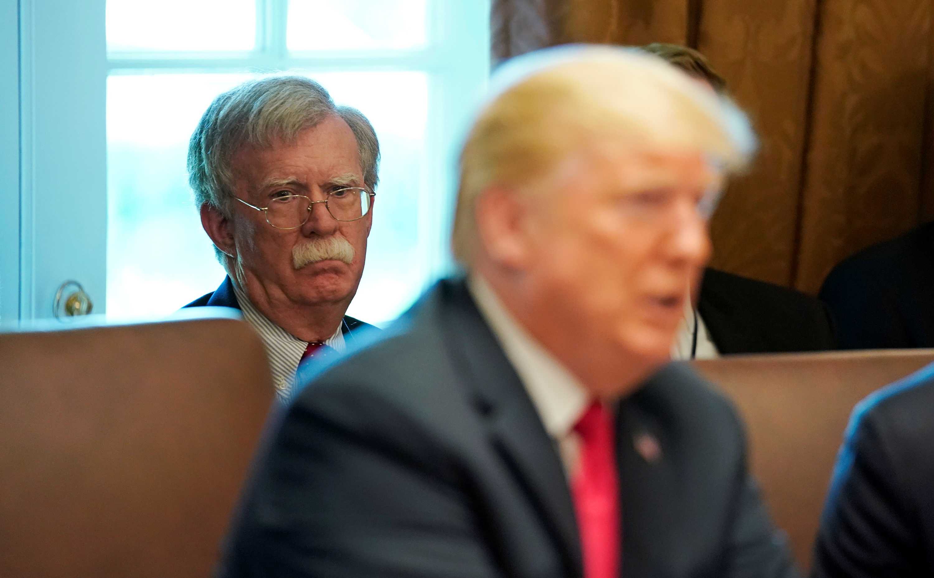 White House national Security Advisor John Bolton listens as US President Donald Trump holds a cabinet meeting