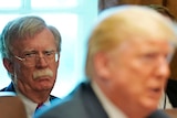 White House national Security Advisor John Bolton listens as US President Donald Trump holds a cabinet meeting