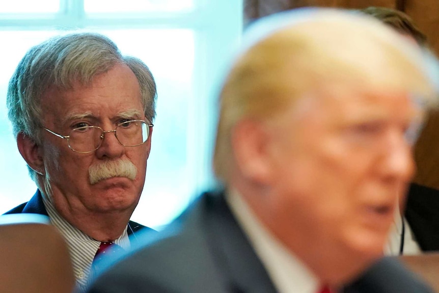 White House national Security Advisor John Bolton listens as US President Donald Trump holds a cabinet meeting