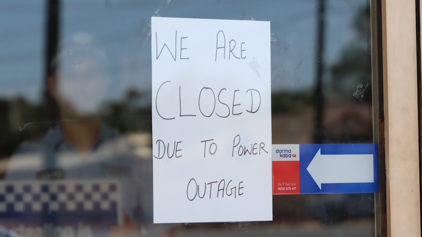 A sign says 'We are closed due to the power outage'