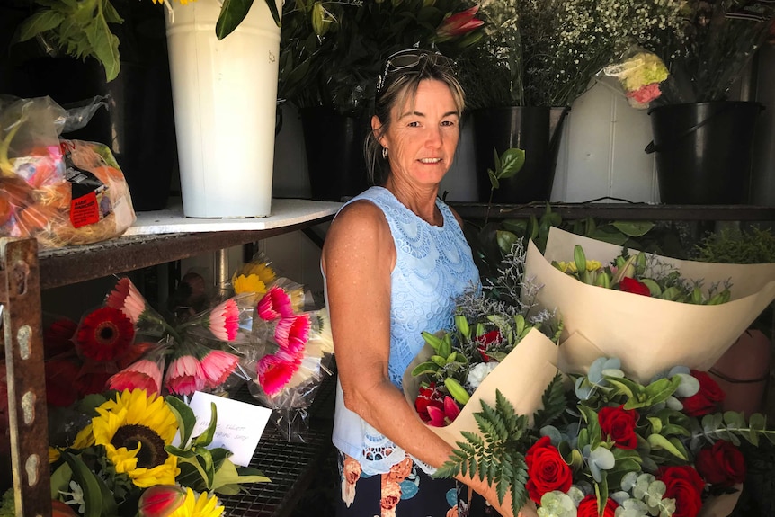 Jan Saunders, a semi-retired florist, standing in a cold room in Longreach.