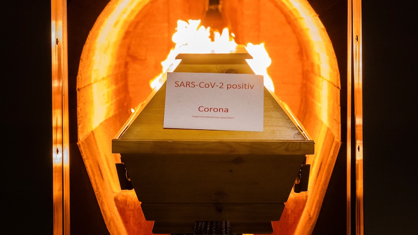 A coffin labelled with a paper 'SARS-CoV-2 positive - Corona' cremated in the crematorium in Germany.