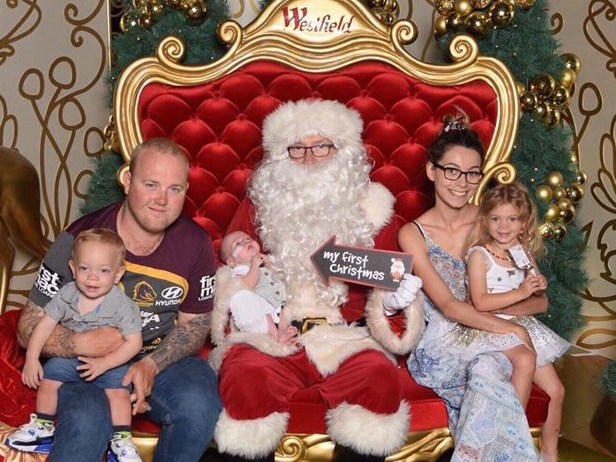 A family of mum, dad, three children and santa.