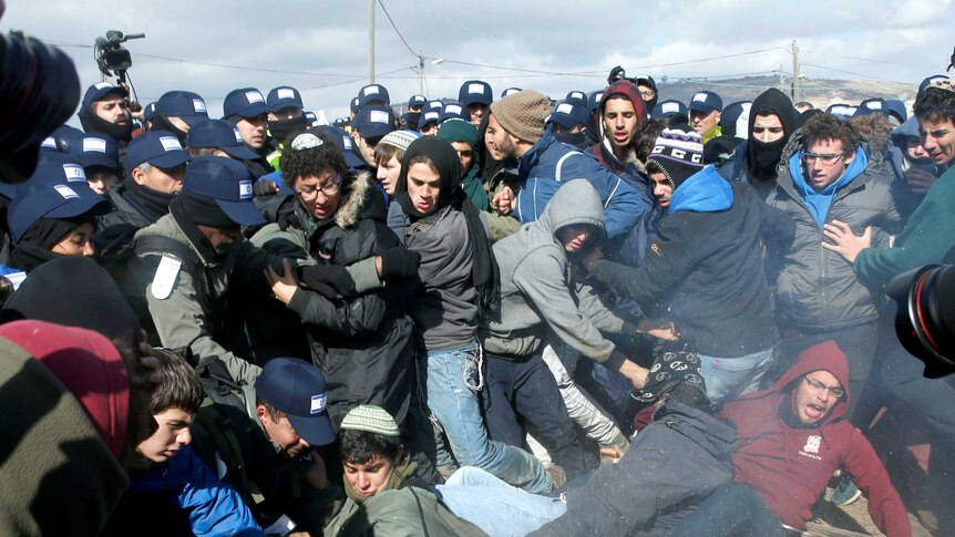 Settlers and police clash in West Bank illegal outpost eviction