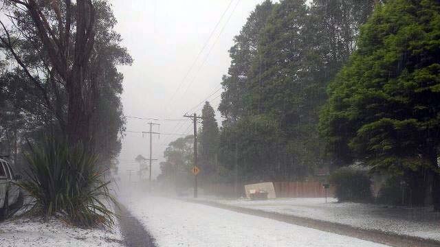 Hail blankets a street in Katoomba