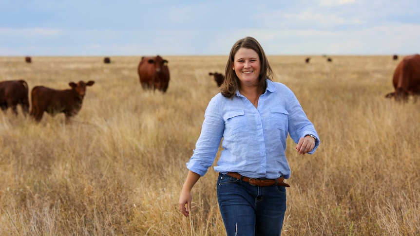 Kiri Broad walking in a paddock.