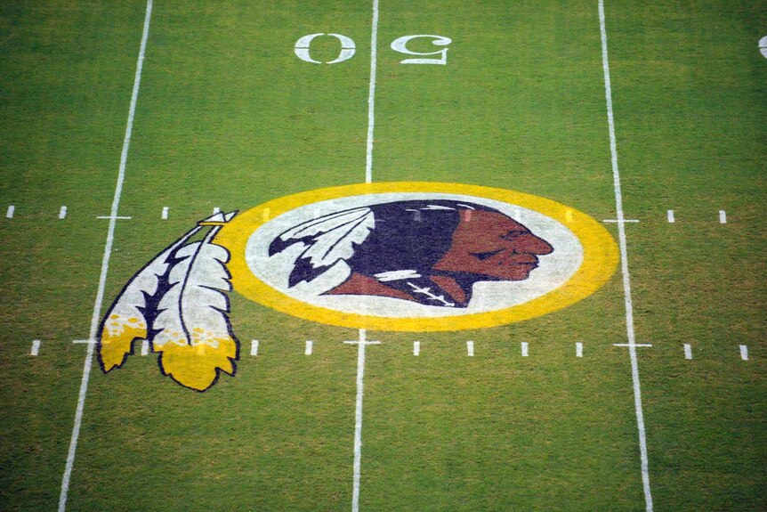 Washington Redskins logo is shown on the field.