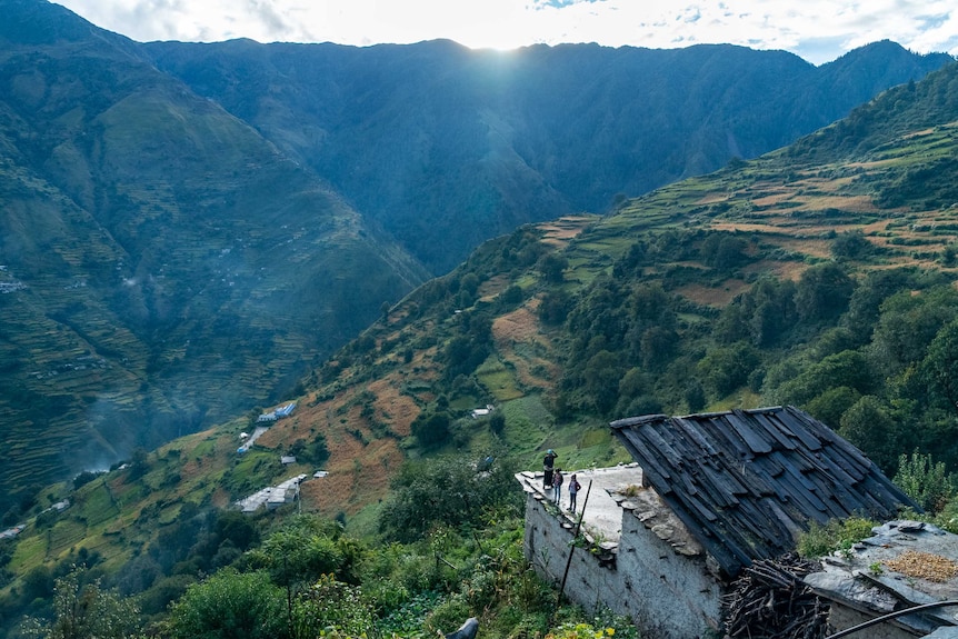 A home clings to the mountainside.