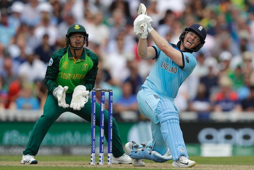 Eoin Morgan looks up while on one knee as he plays a shot