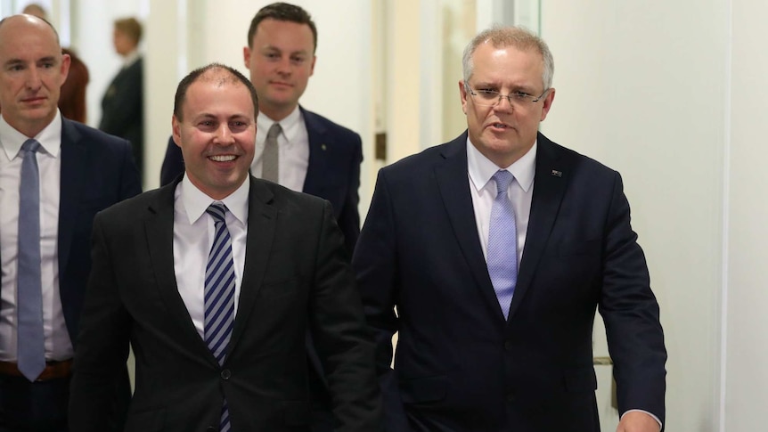 Josh Frydenberg and Scott Morrison walk down a corridor