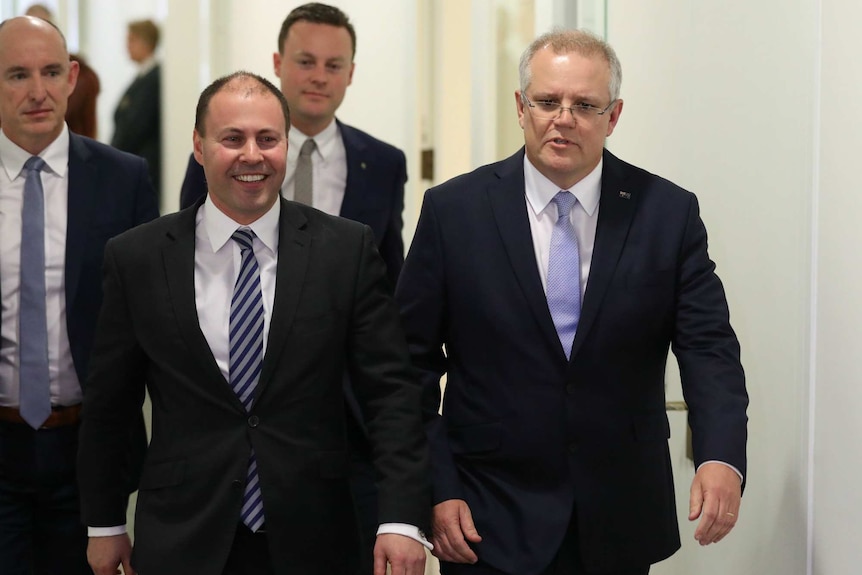 Josh Frydenberg and Scott Morrison walk down a corridor