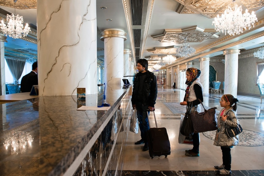 Guests checking into the hotel.