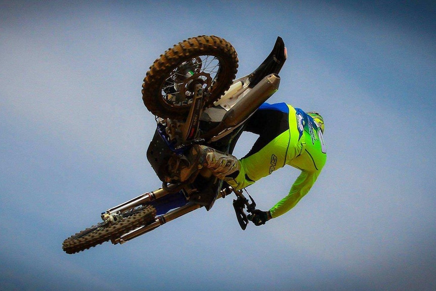 Matthew Phillips gets airborne on a motorcycle.