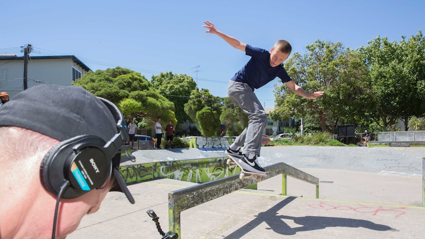 Young skateboarder Keegan Palmer practising a move