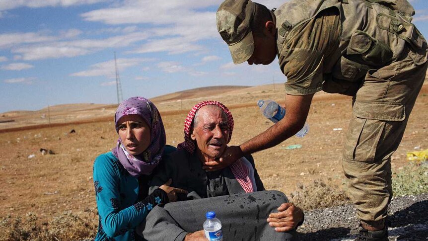 Kurdish refugee collapses