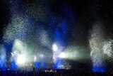 Blue and white glitter and lights as part of Gratte Ciel's Place des Anges above a crowd at Womadelaide.