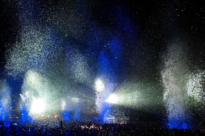 Blue and white glitter and lights as part of Gratte Ciel's Place des Anges above a crowd at Womadelaide.