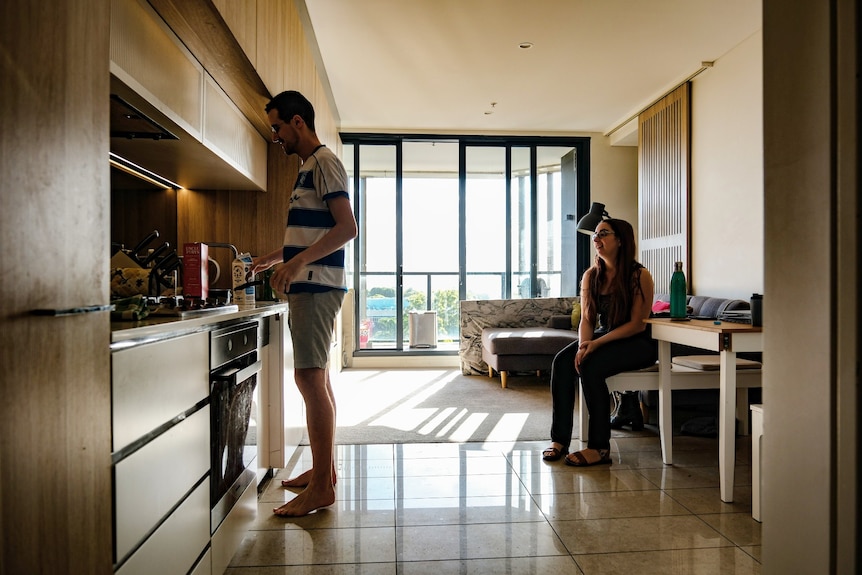 A man and woman in a kitchen