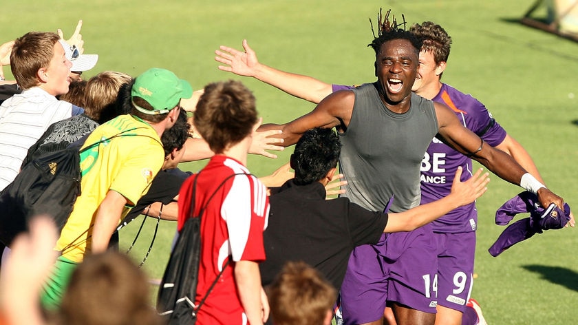 Who's your Dadi...the flamboyant forward celebrates his second goal.