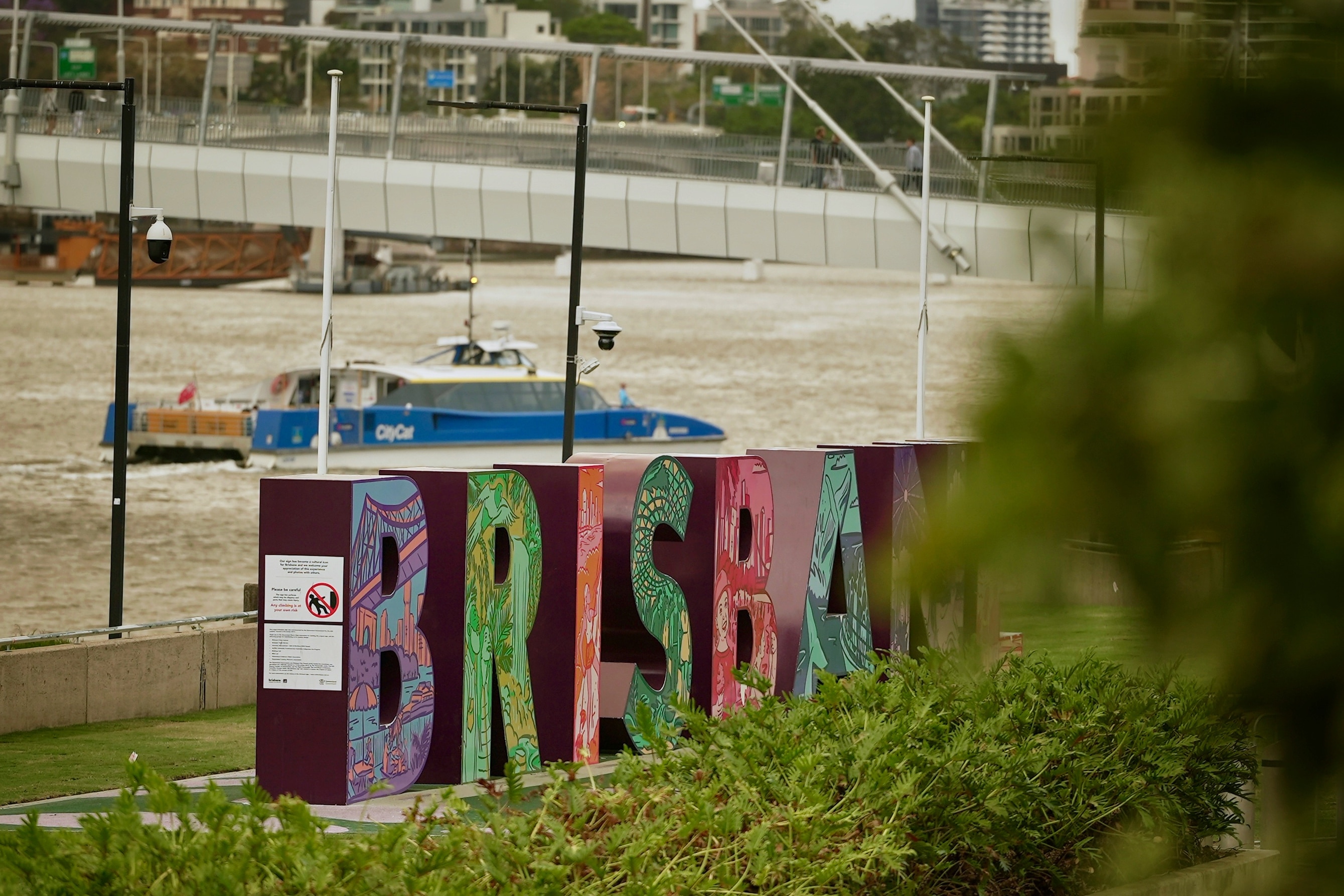 looking through the iconic brisbane sign on to the river
