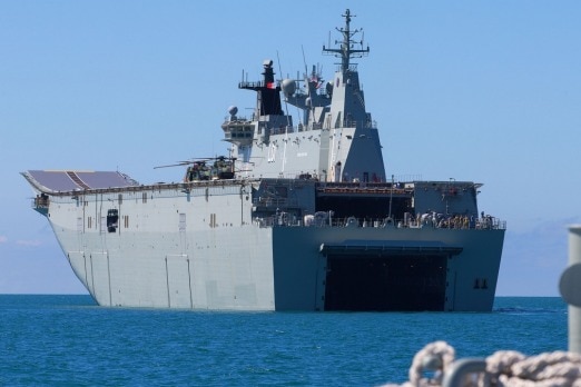 A navy ship out on sea