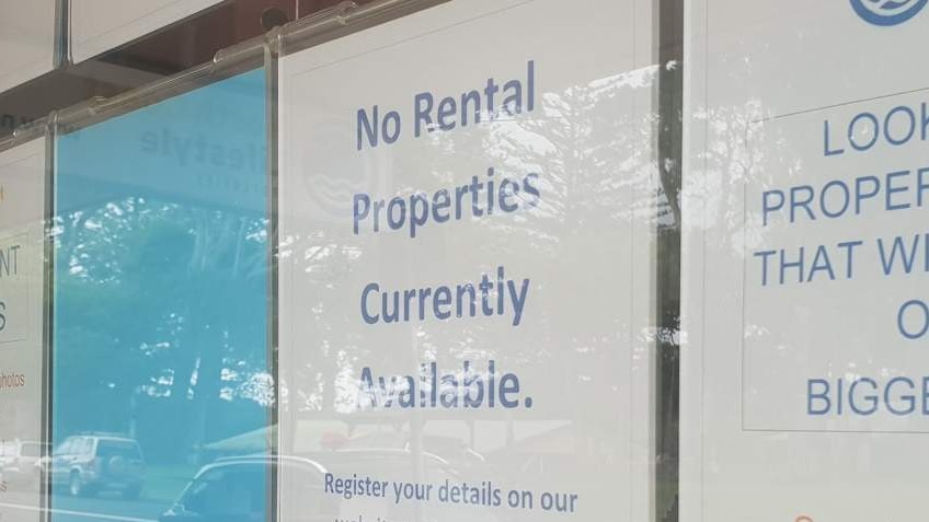 A sign in the window of a Brunswick Heads real estate agency says  there are no permanent rentals available.