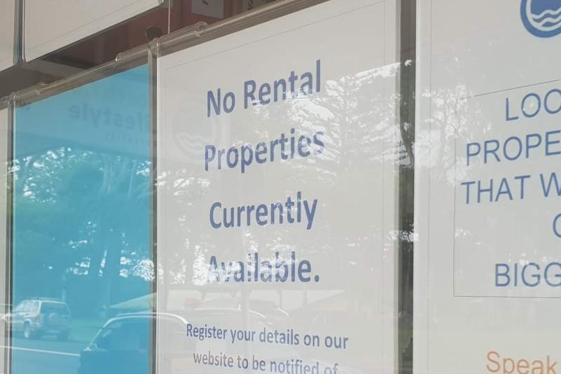 A sign in the window of a Brunswick Heads real estate agency says  there are no permanent rentals available.