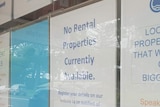 A sign in the window of a Brunswick Heads real estate agency says  there are no permanent rentals available.